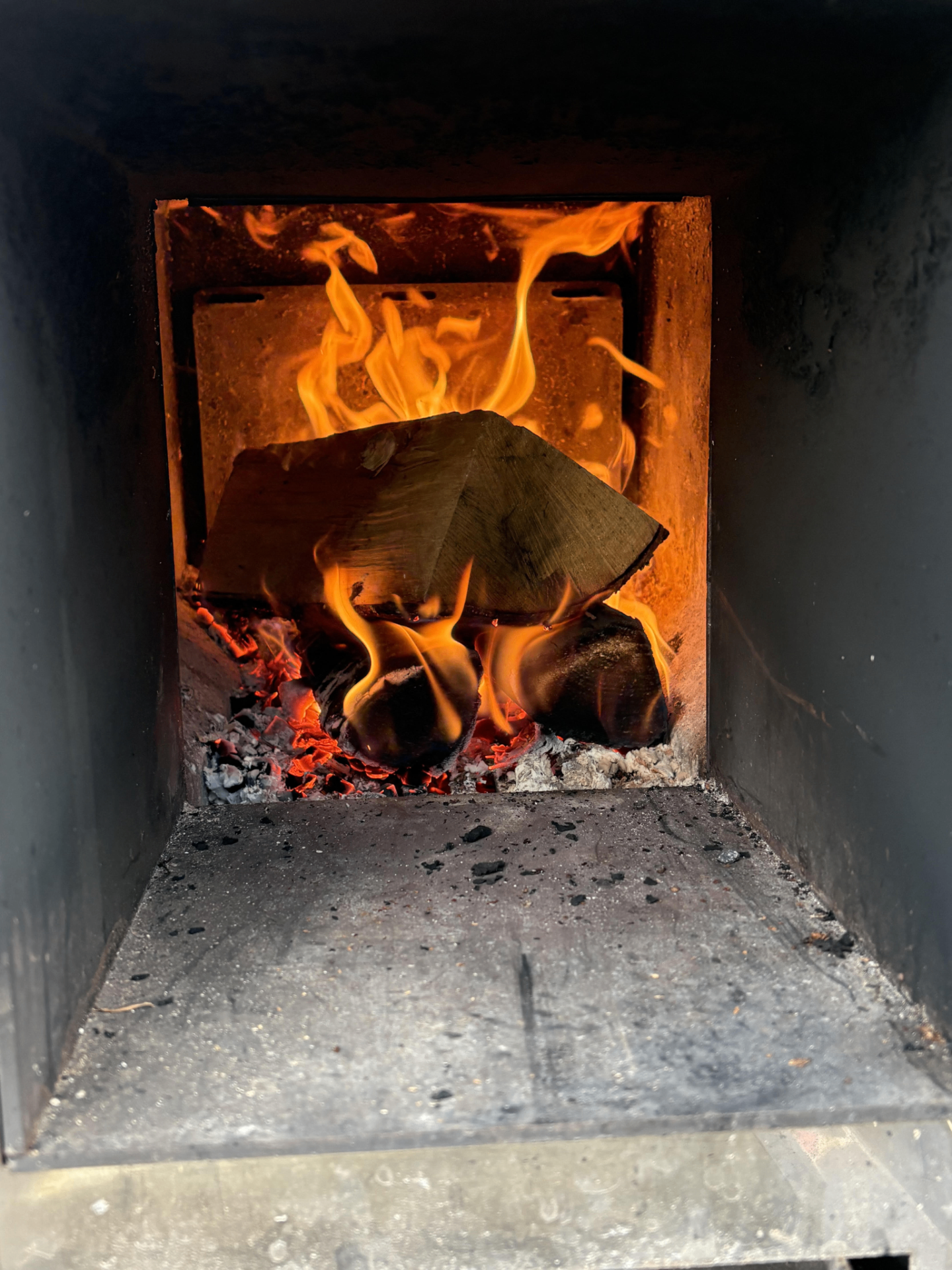 Kiln-dried birch burning in the wood-fired sauna stove