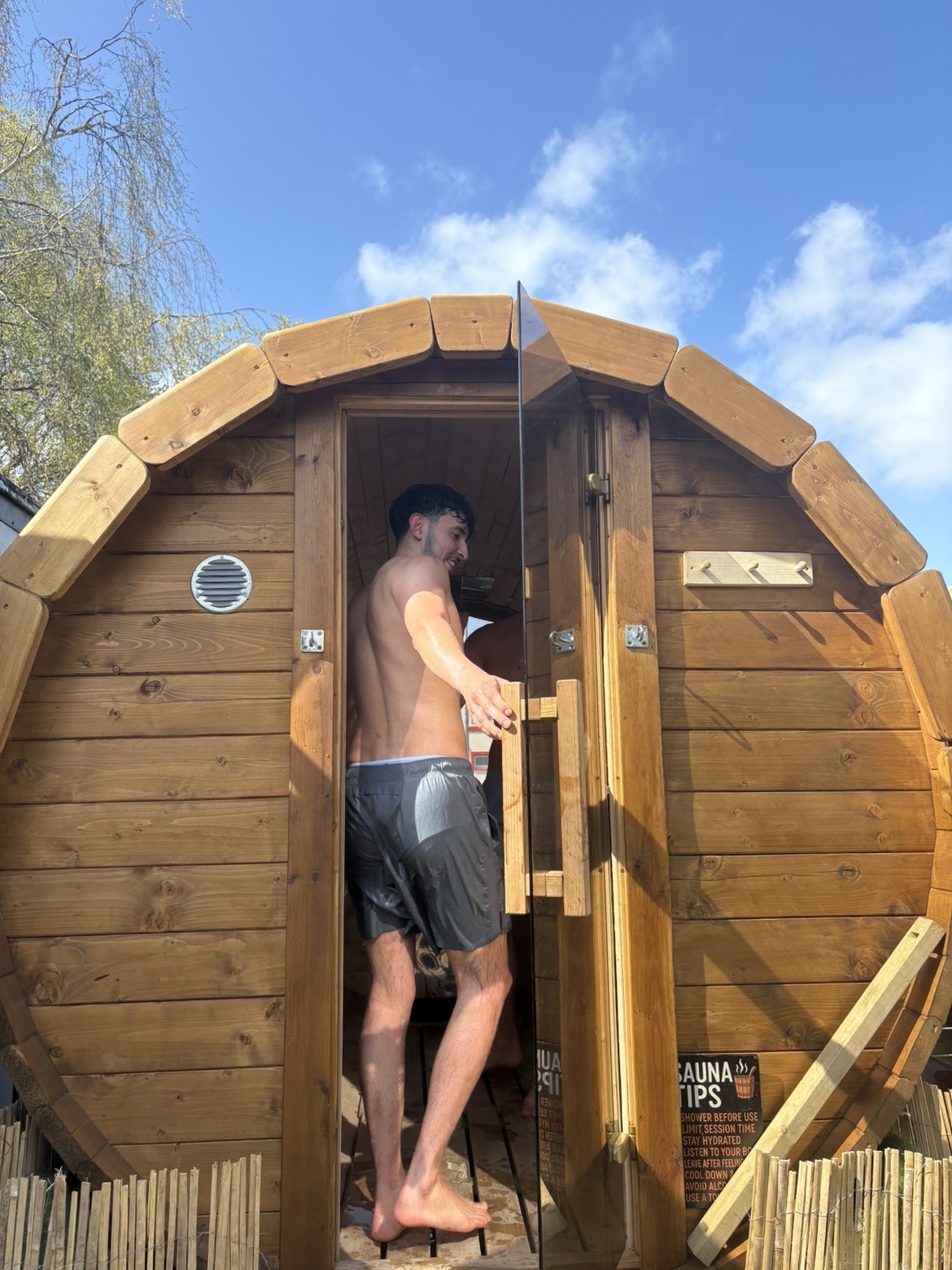 Stepping out of the wood-fired sauna